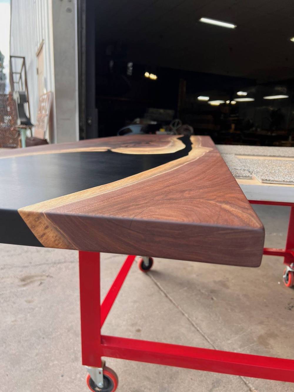 Edge profile of the walnut slab showing thickness and live edge