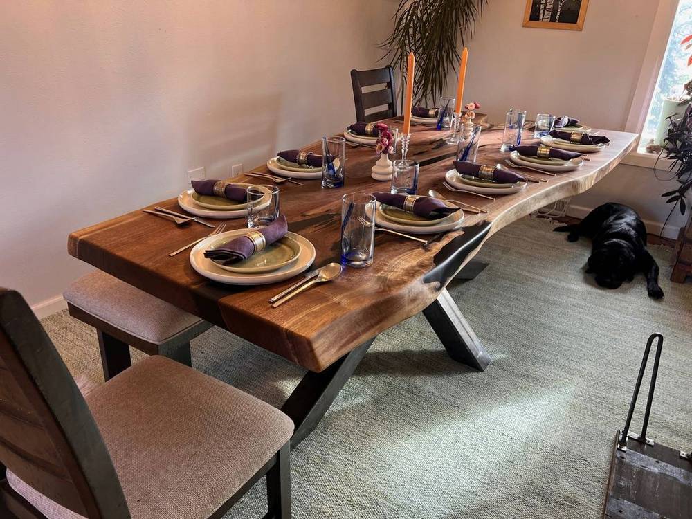 The finished walnut dining table in a styled dining room