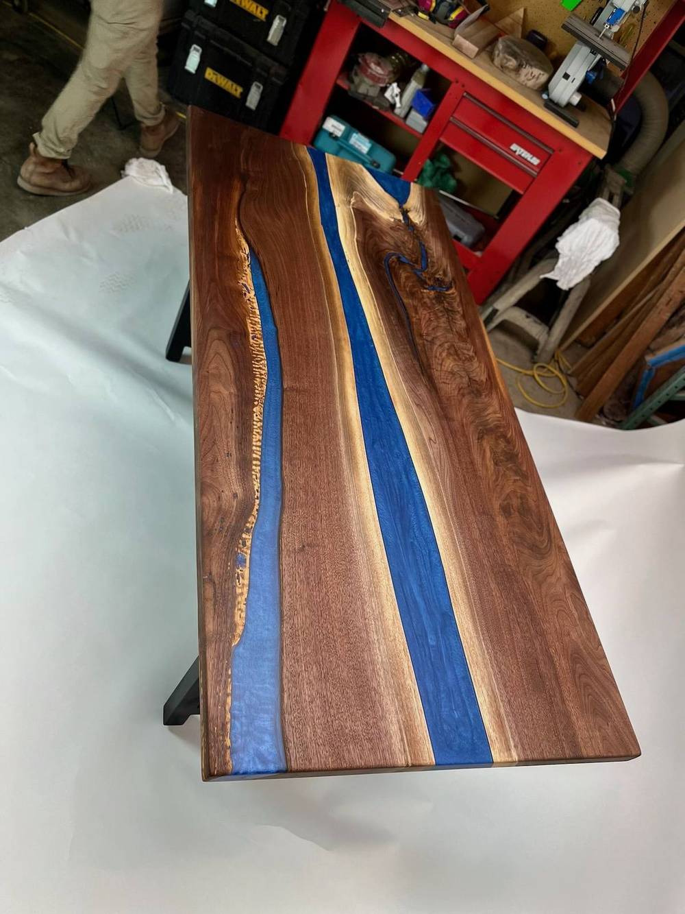 Vertical view of the blue river table showing depth of the epoxy