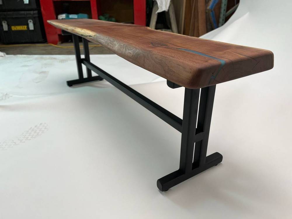 Matching bench built from the same walnut with blue epoxy detail