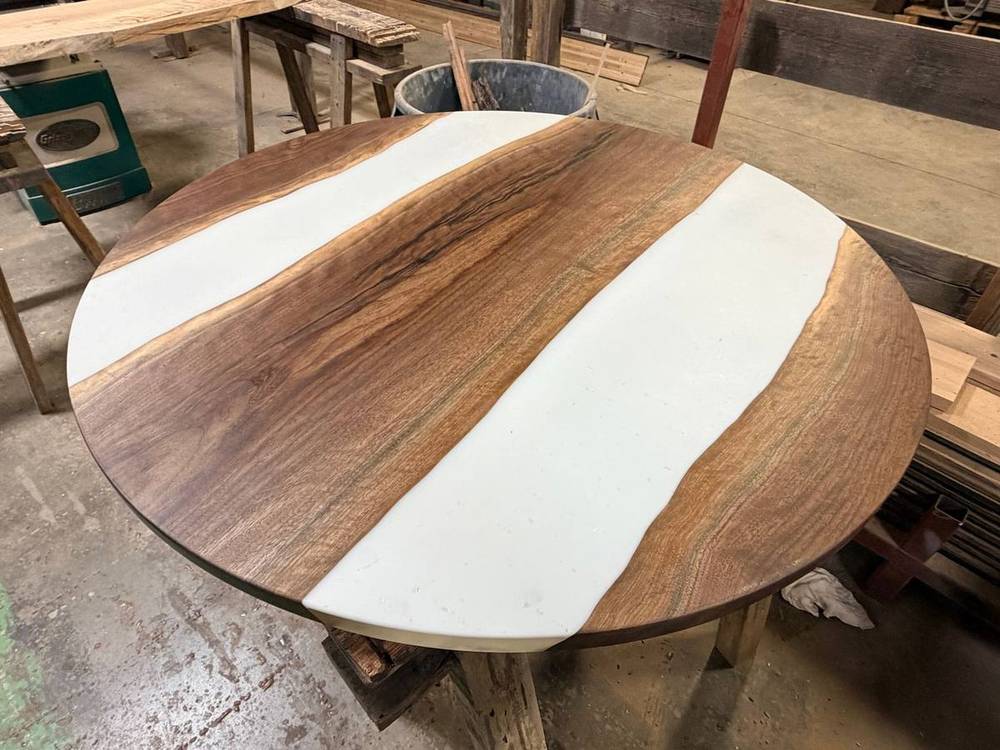 Round live edge table top with white epoxy fill