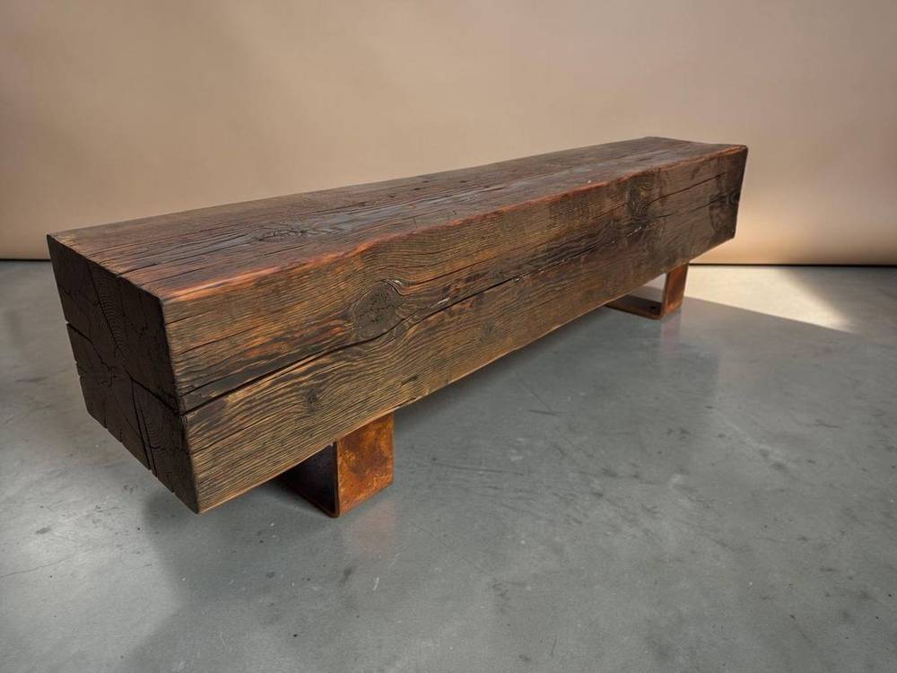 Long reclaimed beam bench on a studio backdrop