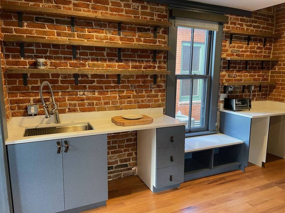 Barnwood and brick kitchenette wall