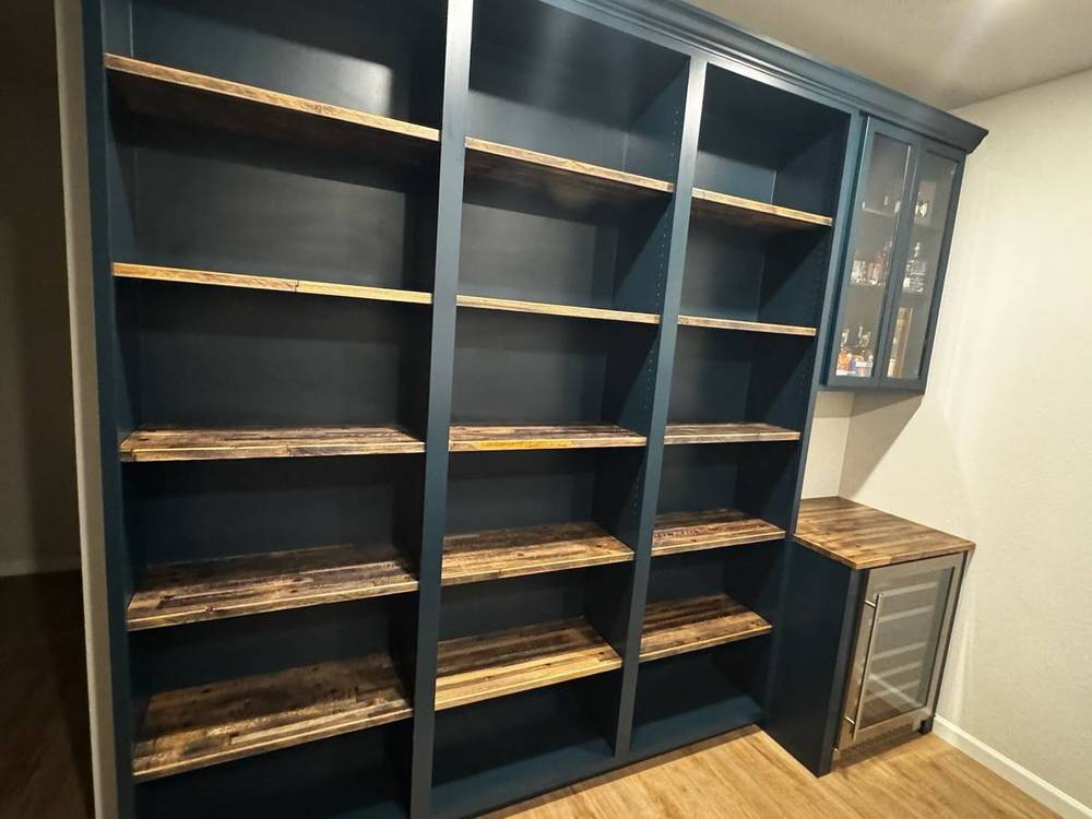 Reclaimed shiplap-edged boards built into a shelving unit