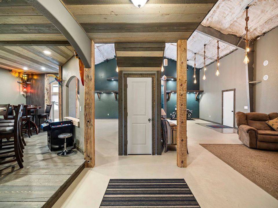 Reclaimed oak beams running across a hallway ceiling