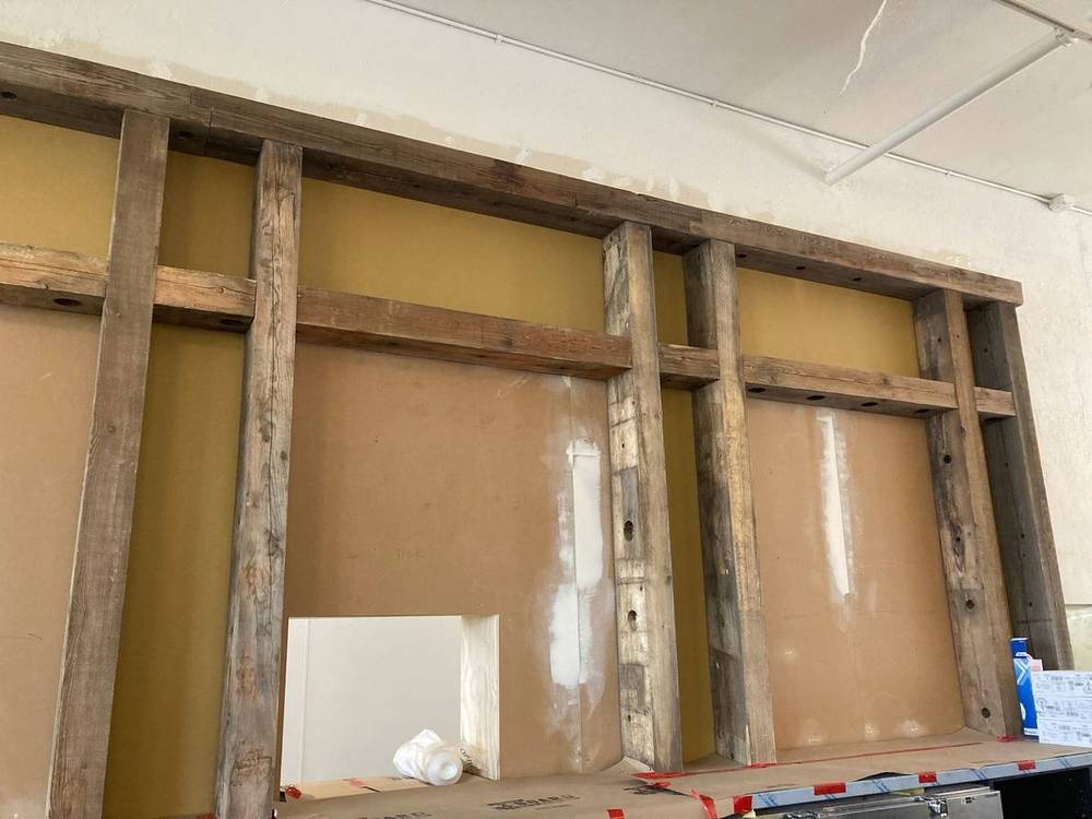 Reclaimed timber beams during framing installation