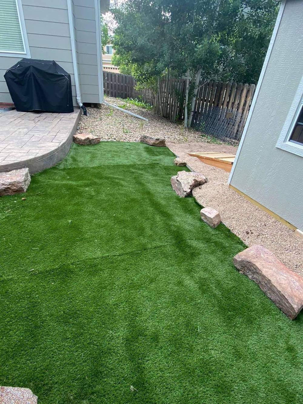 Close detail of reclaimed artificial turf blades and infill