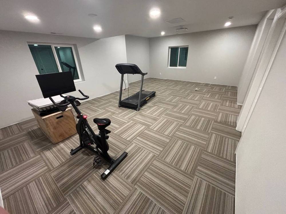 Commercial carpet tile installed across a finished basement floor