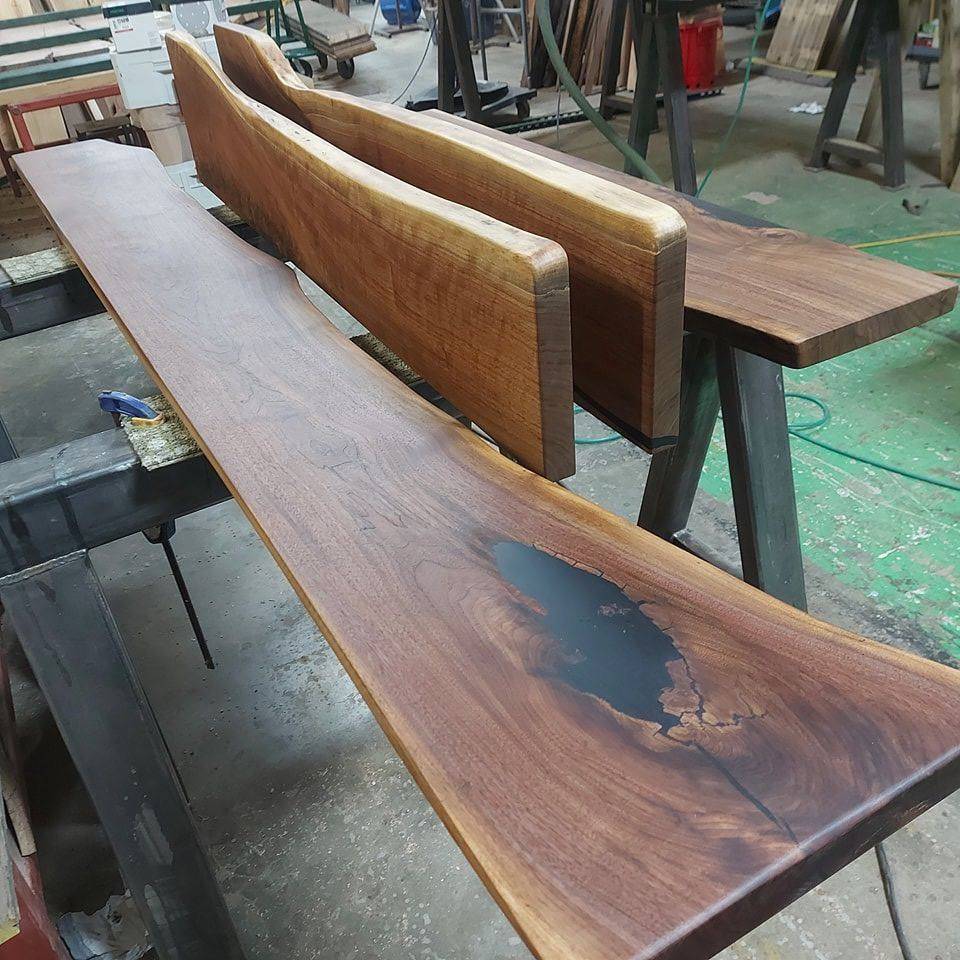 Finishing a reclaimed slab by hand in the Revolve Reclaimed shop